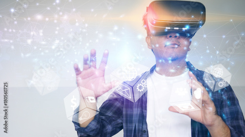 Young man wearing virtual reality glasses. Virtual reality concept.