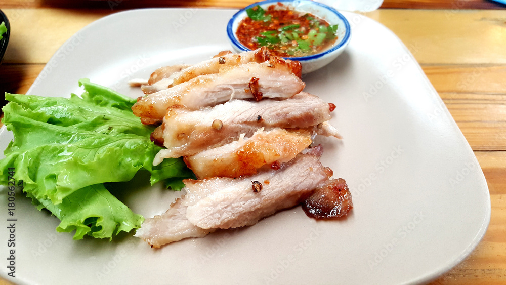 Roast pork and slices isolated on white Chili and fish sauce Roast pork and slices isolated on white Chili and fish sauce