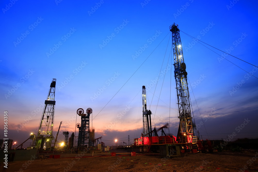 In the evening of oilfield derrick