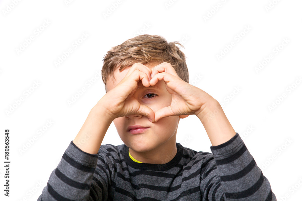 young blonde boy make a heart with his hands and fingers young blonde boy make a heart with his hands and fingers