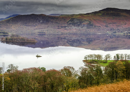 Reflections of a mountain on a lake in autumn.