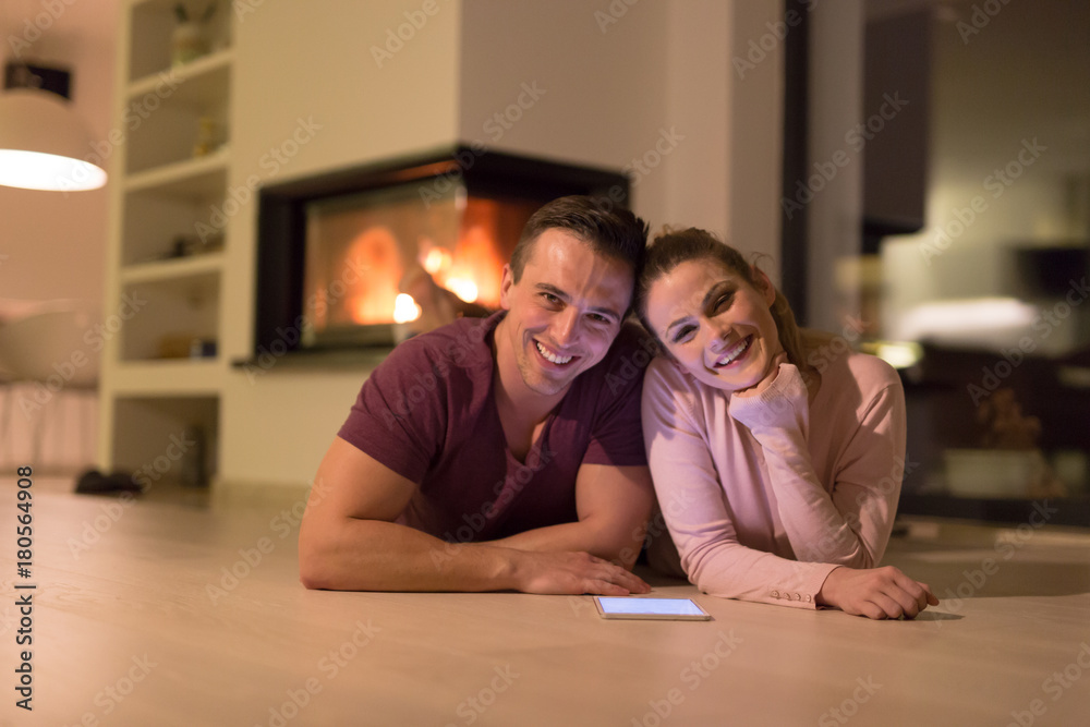 Young Couple using digital tablet on cold winter night Young Couple using digital tablet on cold winter night