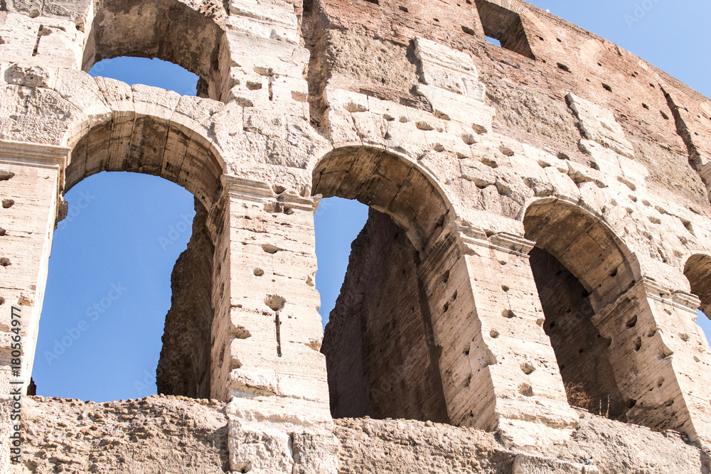 Part of the Colosseum in Rome with some arches in detail