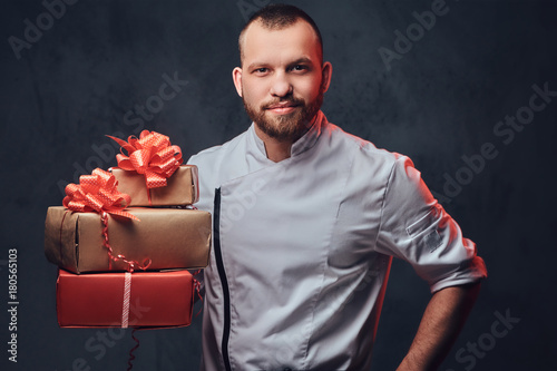 Chef cook holds colorful pa...