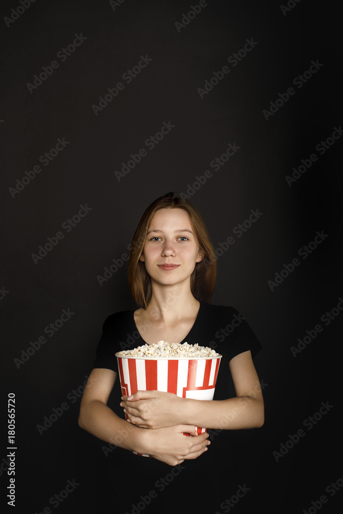woman with bucket of popcorn