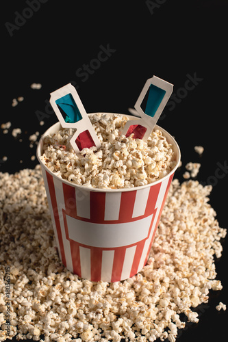 bucket of popcorn with 3d glasses