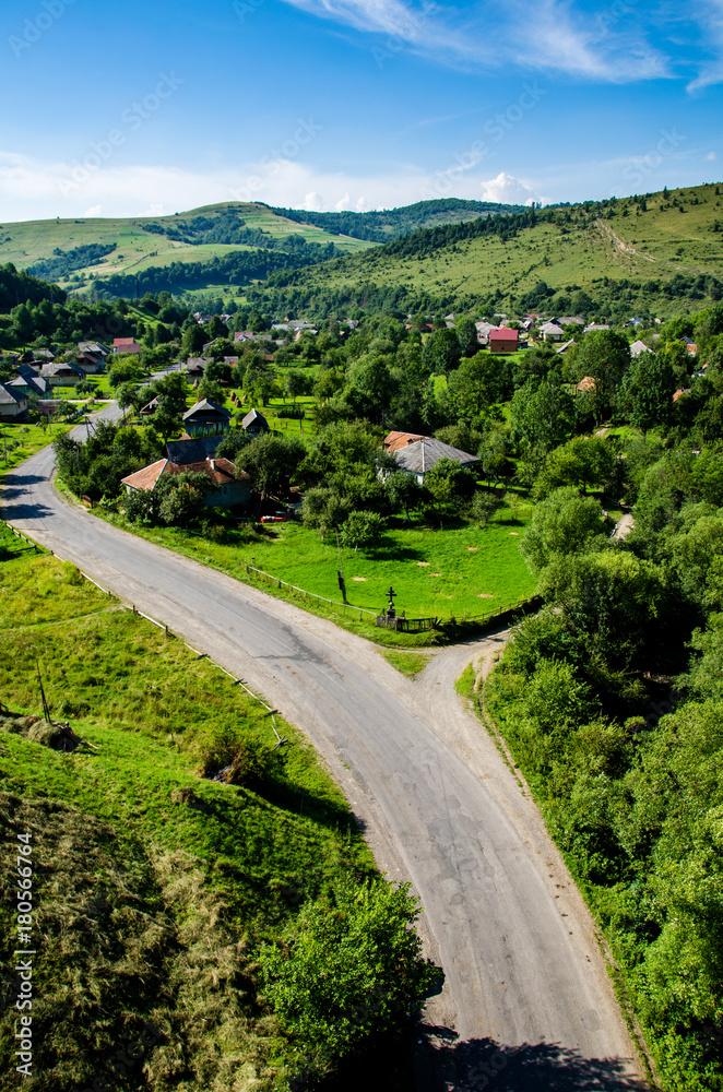 Road in the background of beautiful Carpathian mountains. Summer season