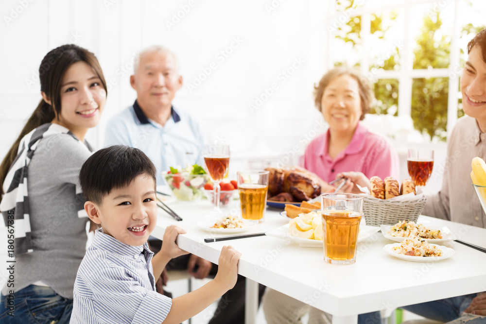 happy asian family having dinner at home