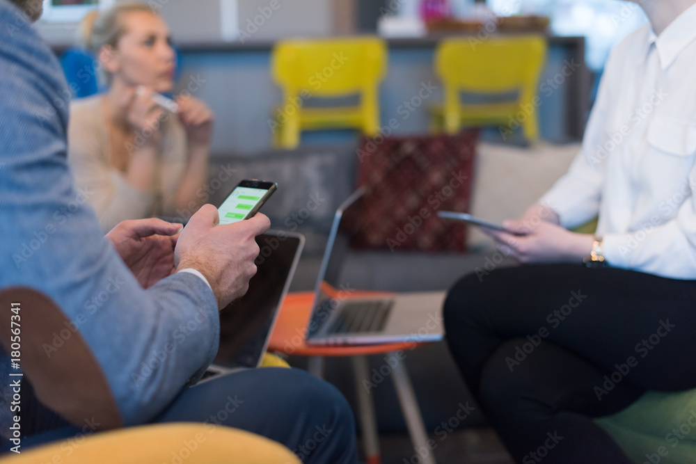 Young casual businessman using smartphone Young casual businessman using smartphone