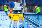 Theodolite at the construction site. Construction work using theodolite.