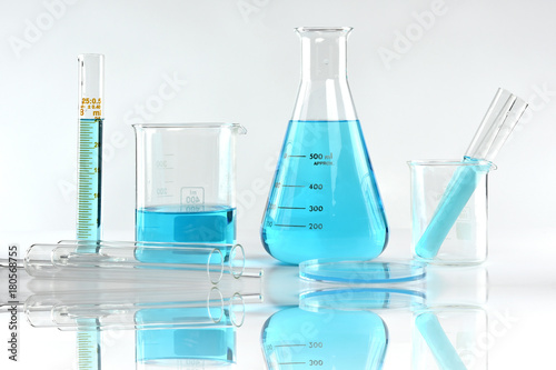 Scientific laboratory experimental glassware with clear solution, Symbolic of science research and development.