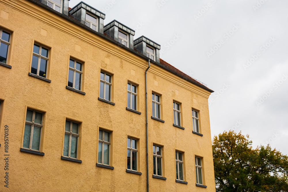 Fototapeta premium brown apartment house on a cloudy day