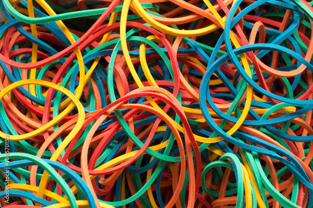 colorful elastic rubber bands in a pile from above