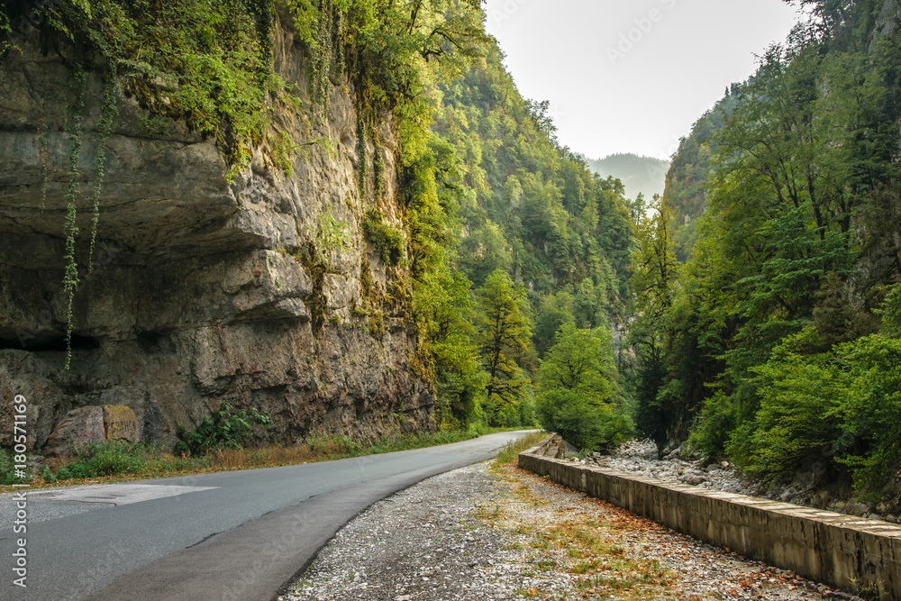 Good asphalt road through gorge along Bzyb river near Ritsa lake in Abkhazia