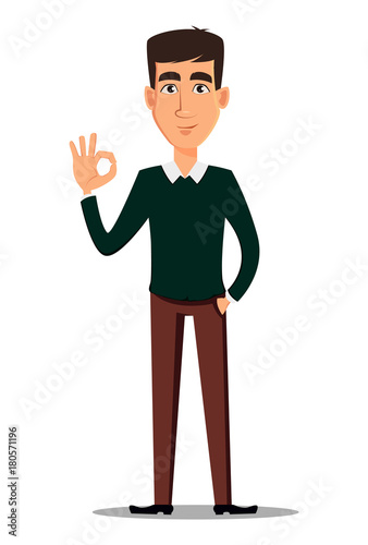 Young handsome smiling businessman in smart casual clothes showing OK sign