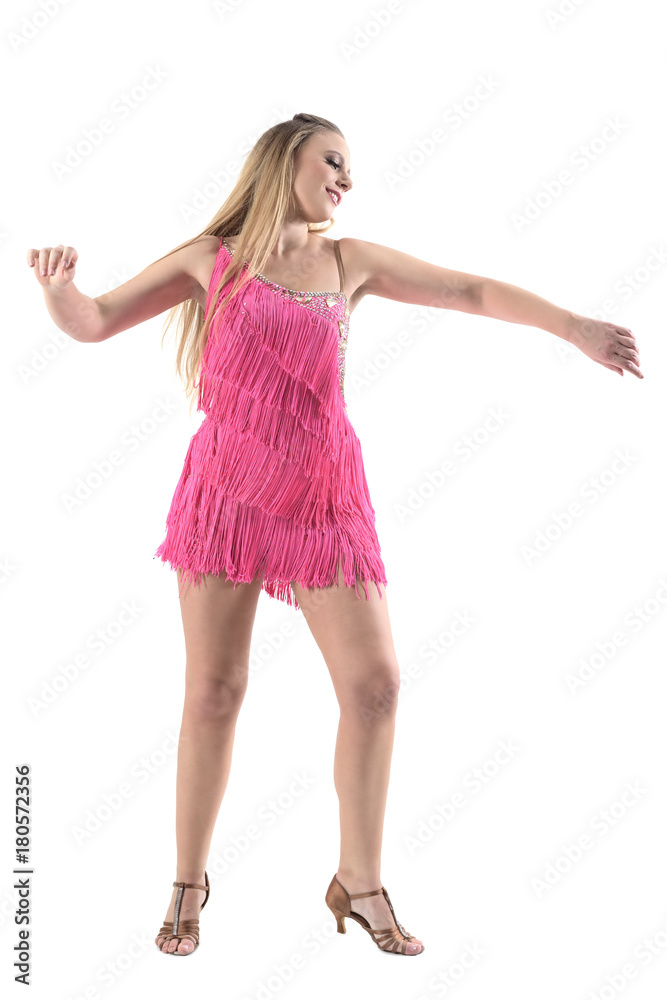Joyful smiling caucasian woman dancing Latino dances in pink fringe dress. Full body length portrait isolated on white studio background. Joyful smiling caucasian woman dancing Latino dances in pink fringe dress. Full body length portrait isolated on white studio background.