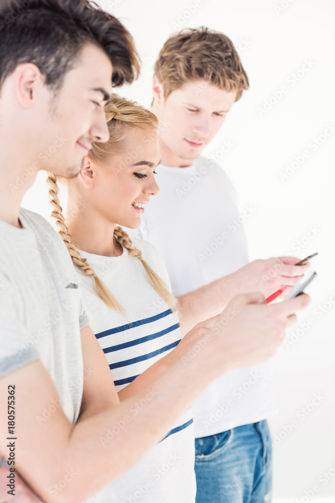 young friends using smartphones young friends using smartphones