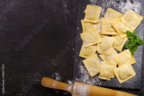 fresh ravioli on dark board photo