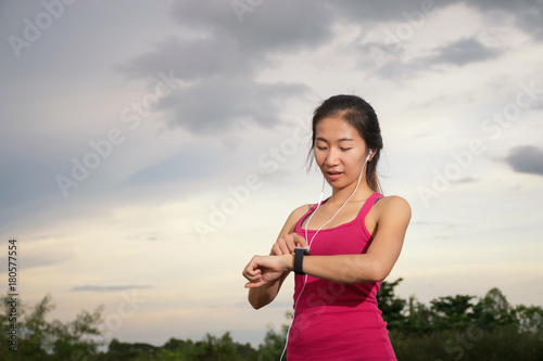 Asian woman and smartwatch © njphotos