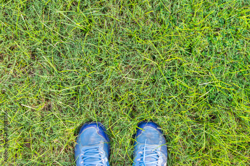 feet on the grass field