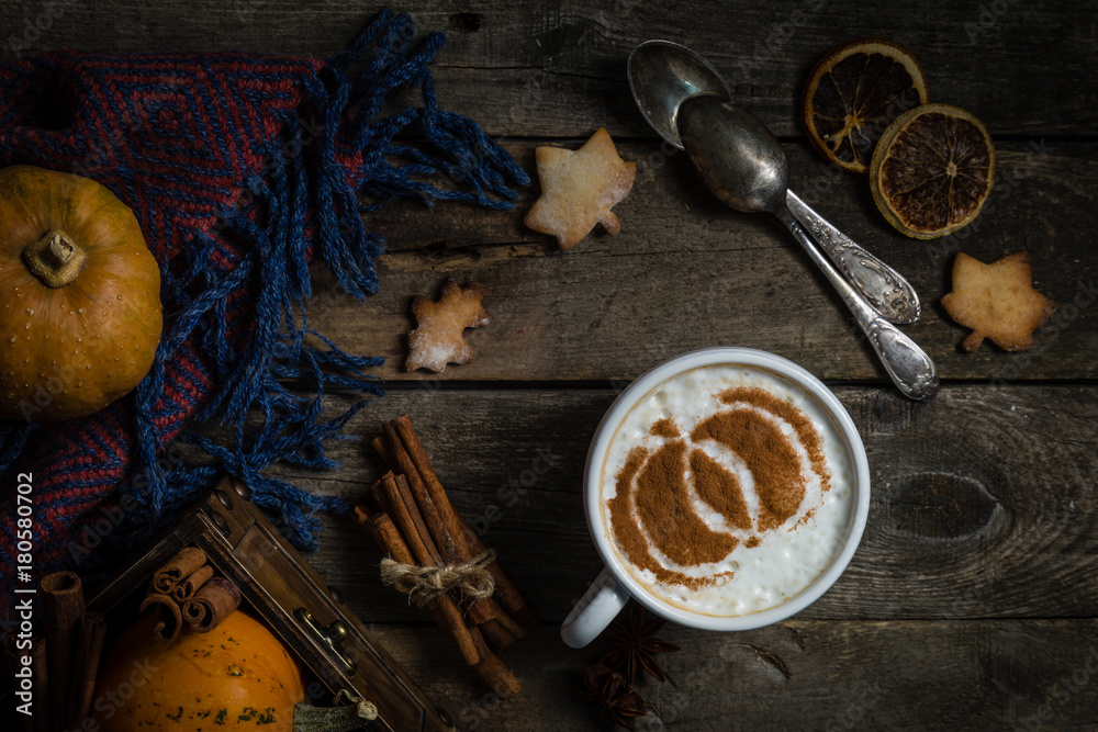 Autumn pumpkin spice latte on rustic wood background Autumn pumpkin spice latte on rustic wood background
