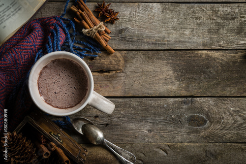 Winter hot chocolate on rustic background