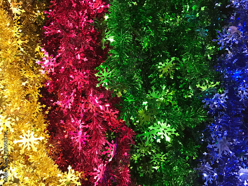 Colorful christmas tinsel and sparkling garland trimming