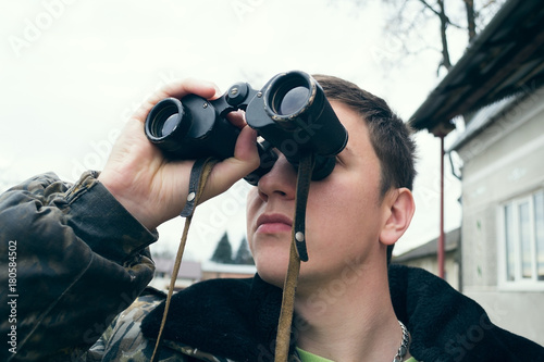 Hunter with binoculars photo