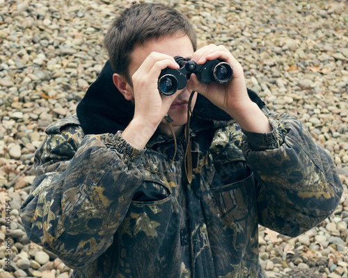 Hunter with binoculars photo
