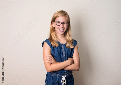 Health, education and people concept. Happy teen girl in braces and eyeglasses isolated.