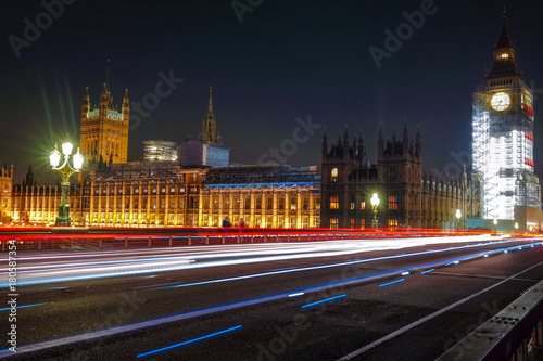 Night scene with light trails on the Westminster bridge. Big Ben and House of Parliament in London, The United Kingdom of Great Britain.