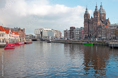 City scenic from Amsterdam with the St. Niklaas church in the Netherlands photo