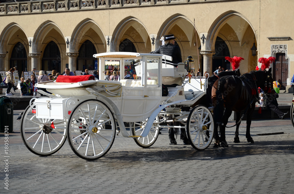 Cab on the main square - old town in Krakow, Poland