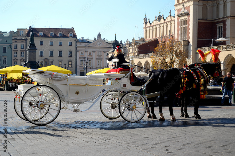 Cab on the main square - old town in Krakow, Poland