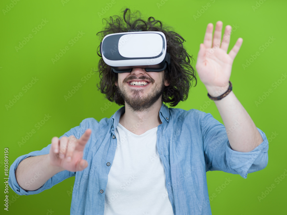 man using VR headset isolated on green background man using VR headset isolated on green background