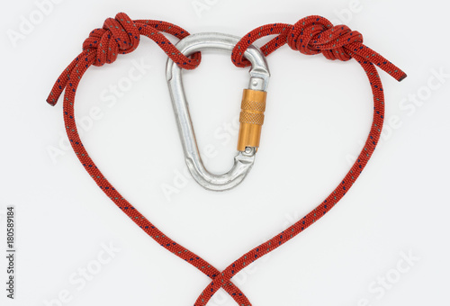 Red heart on a white background; Rope with knots united in symbol of love; Original congratulation for Valentine's Day photo