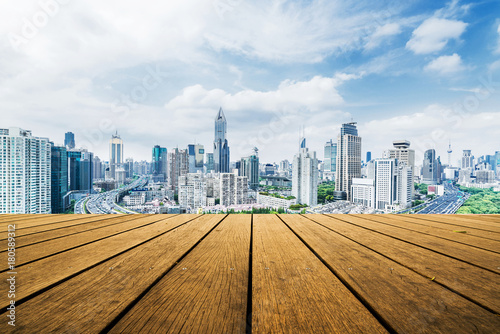 Panoramic skyline and buildings with empty wooden board