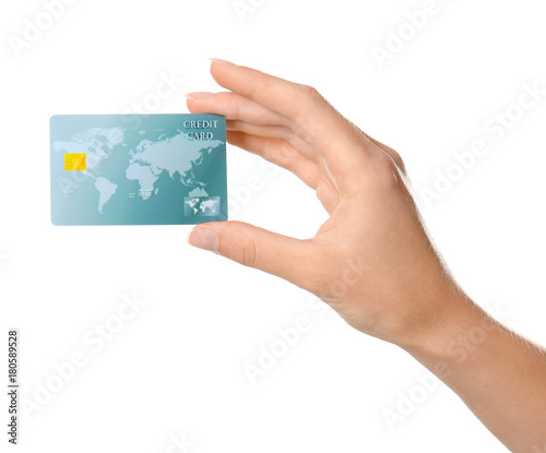 Woman's hand holding credit card on white background