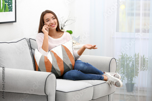 Young woman with mobile pho...