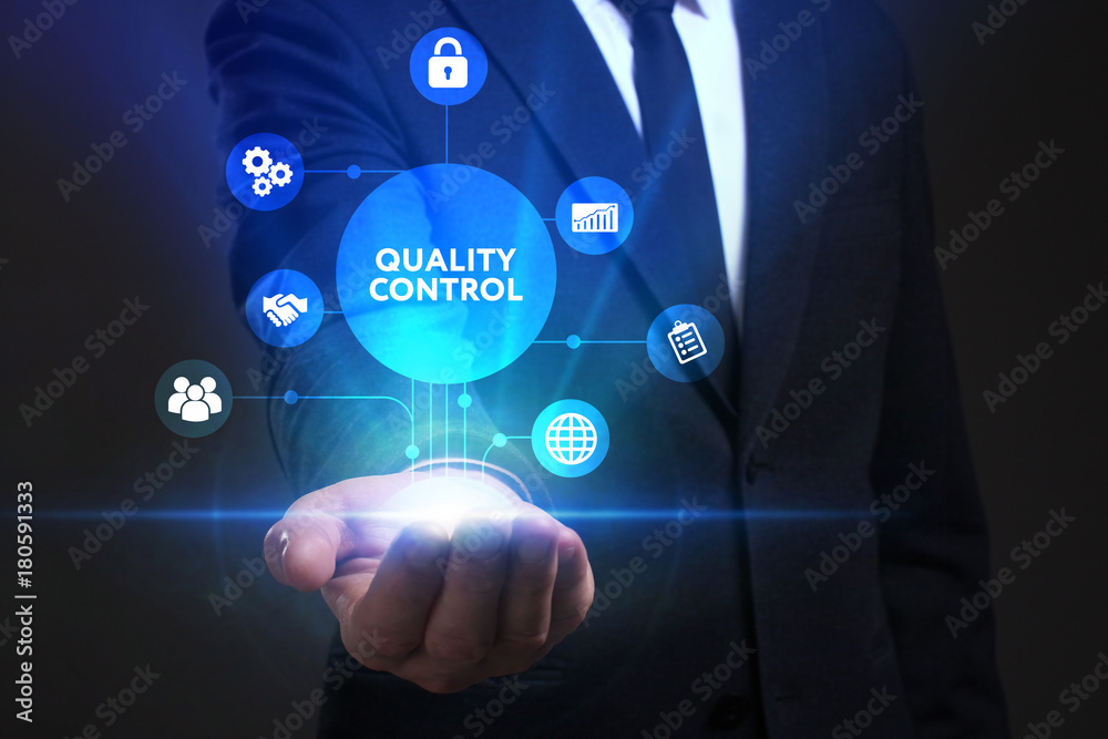 Fototapeta premium Business, Technology, Internet and network concept. Young businessman working on a virtual screen of the future and sees the inscription: Quality control
