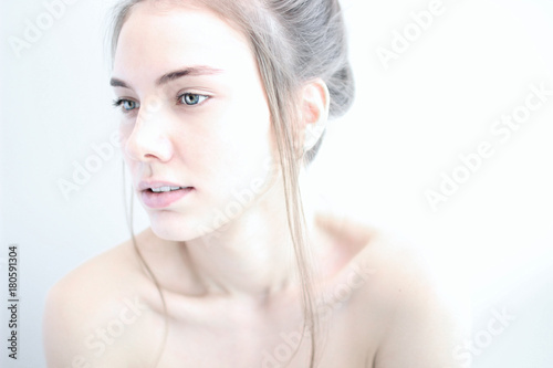 portrait of a girl in high key on white background