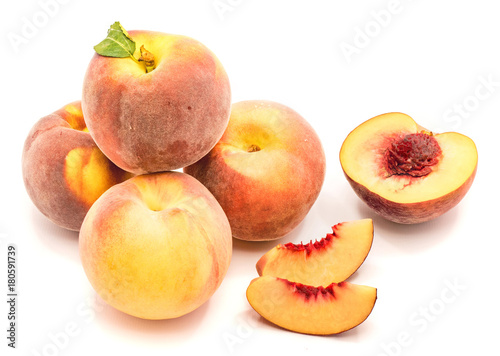 Whole and sliced peaches composition isolated on white background.