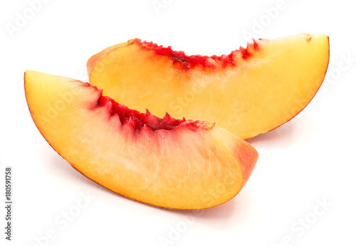 Two peach slices isolated on white background.