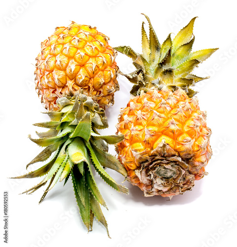 Two whole pineapples isolated on white background. photo