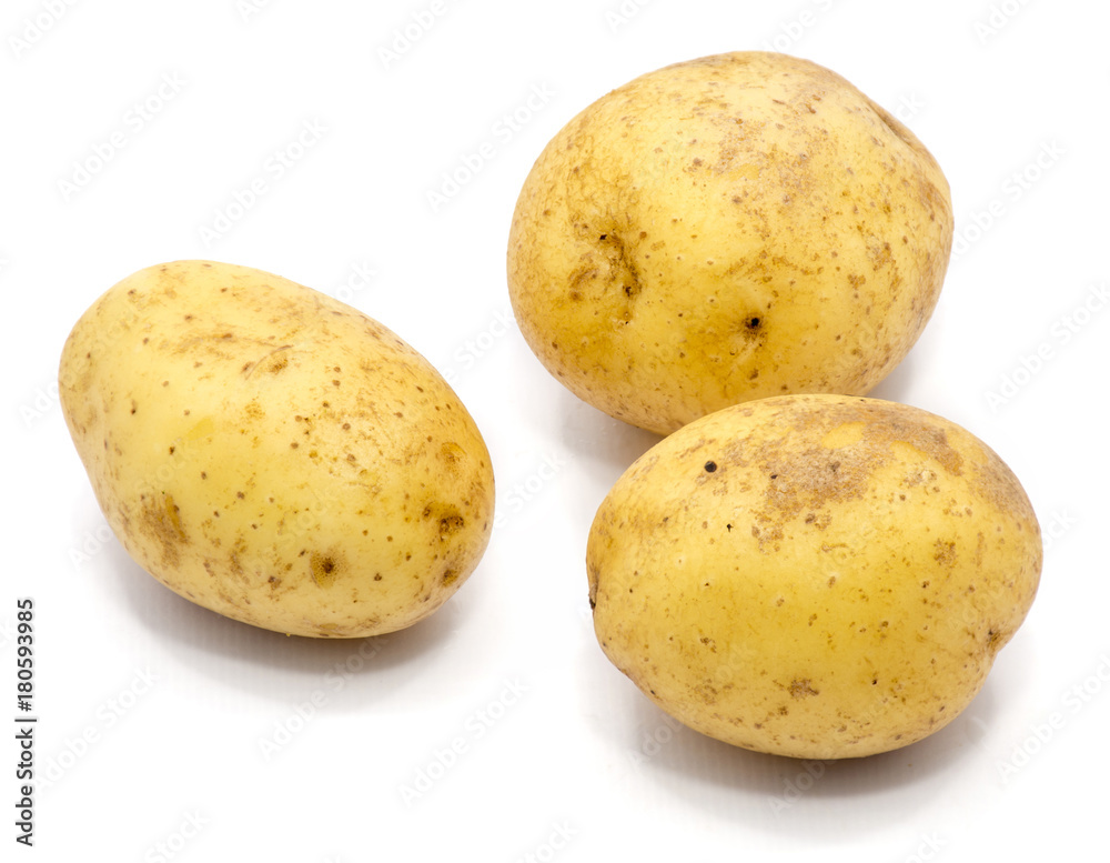 Three whole potatoes isolated on white background. Three whole potatoes isolated on white background.