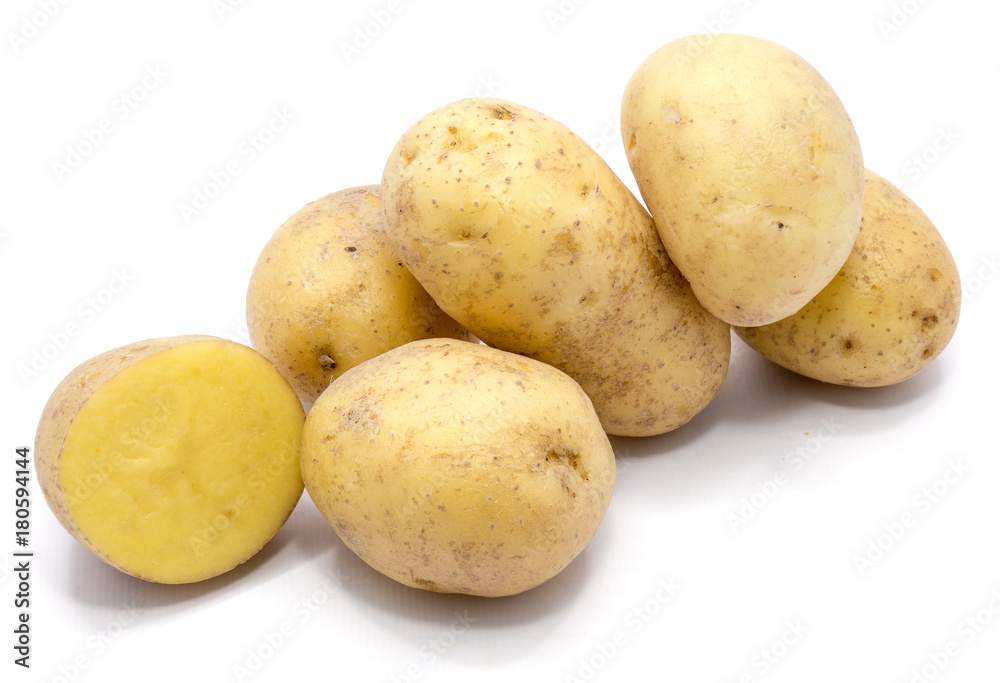 Group of whole potatoes and a half isolated on white background.