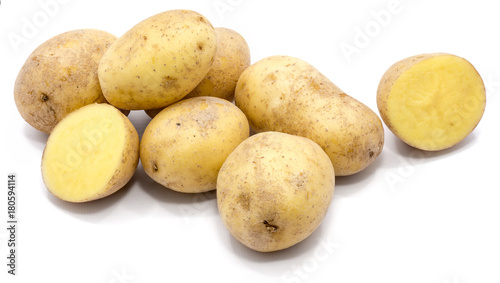 Group of whole potatoes and two halves isolated on white background.