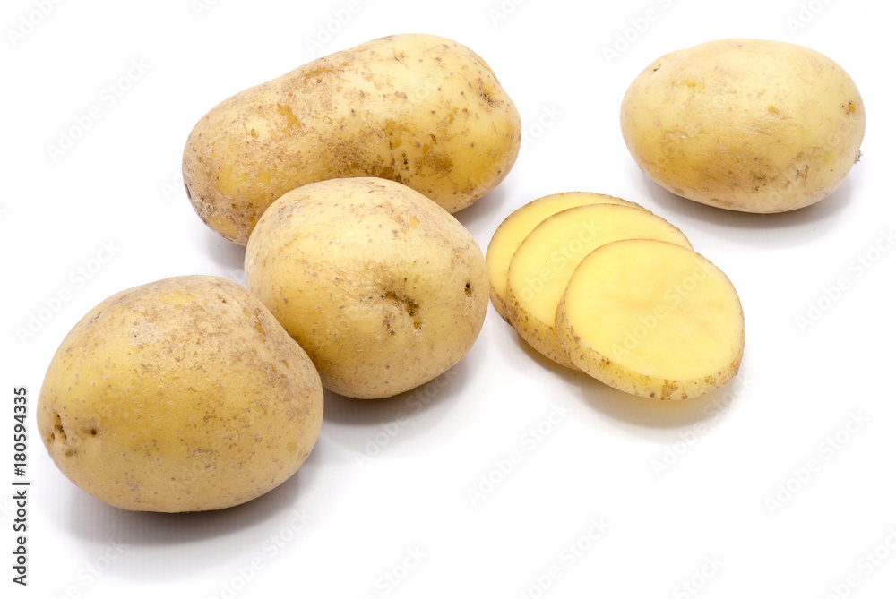 Group of whole potatoes with slices isolated on white background. Group of whole potatoes with slices isolated on white background.
