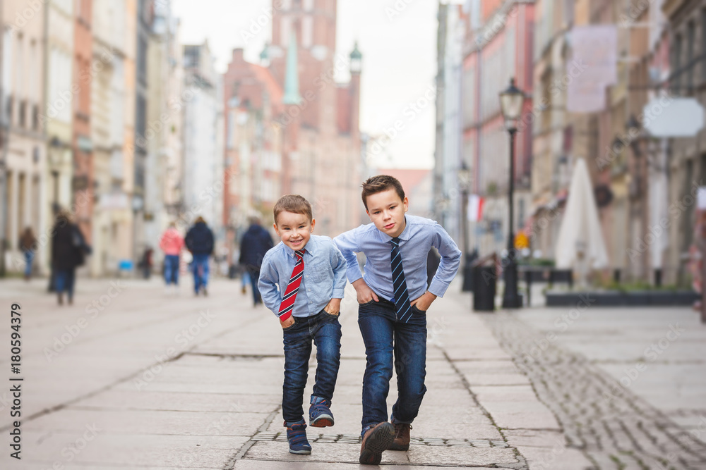 Two boys in an old town