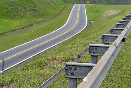 Road in perspective with highlight to the guardrail photo